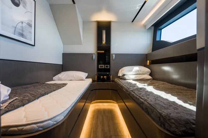 Slide: The Image of Luxurious 2024 Pearl 72 yacht cabin with twin beds, modern design, and ambient lighting. - 71