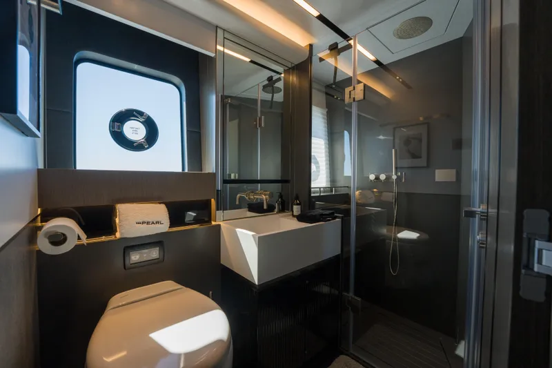 Slide: The Image of Luxurious bathroom in 2024 Pearl 72 yacht with modern fixtures and elegant design. - 72