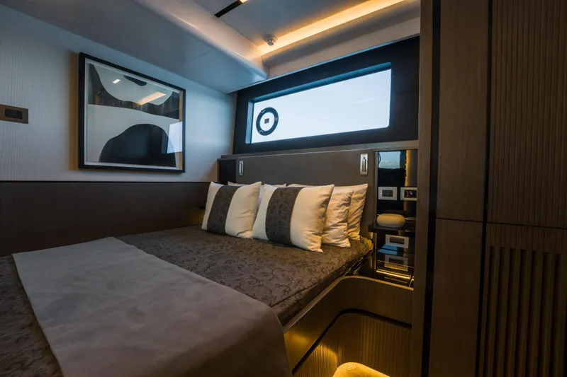 Slide: The Image of Luxurious bedroom interior of 2024 Pearl 72 yacht with modern decor and ambient lighting. - 75