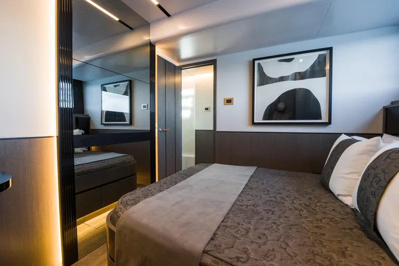 Slide: The Image of Luxurious bedroom interior on 2024 Pearl 72 yacht, featuring modern decor and elegant lighting. - 76