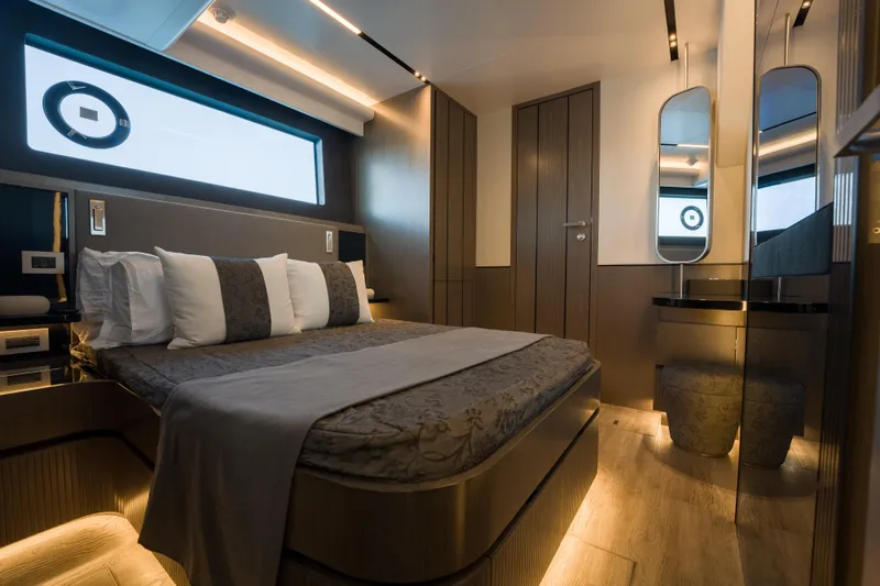 Slide: The Image of Luxurious bedroom interior of 2024 Pearl 72 yacht with modern design and ambient lighting. - 77