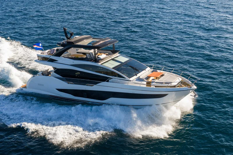 Slide: The Image of Luxurious 2024 Pearl 72 yacht cruising on open sea, showcasing sleek design and elegance. - 8