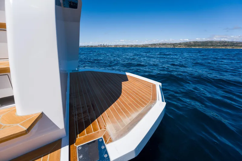 Slide: The Image of Luxury yacht Pearl 72, 2024 model, with wooden deck on open sea. - 80