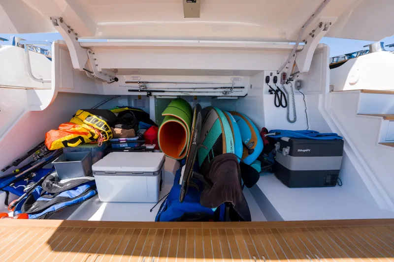 Slide: The Image of Storage compartment of 2024 Pearl 72 yacht with outdoor gear and equipment. - 82