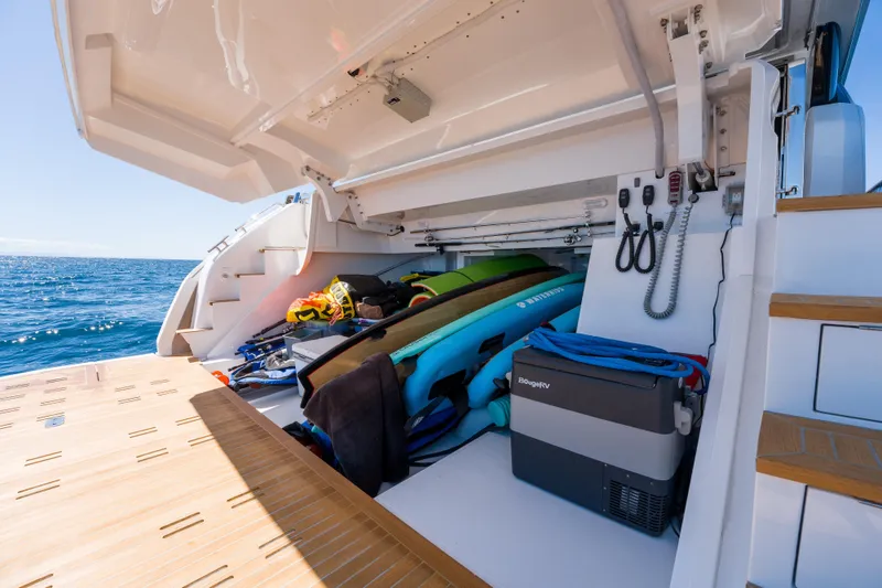 Slide: The Image of Storage compartment of 2024 Pearl 72 yacht with water sports equipment and accessories. - 83