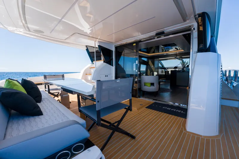 Slide: The Image of Luxurious 2024 Pearl 72 yacht deck with modern seating and ocean view. - 84