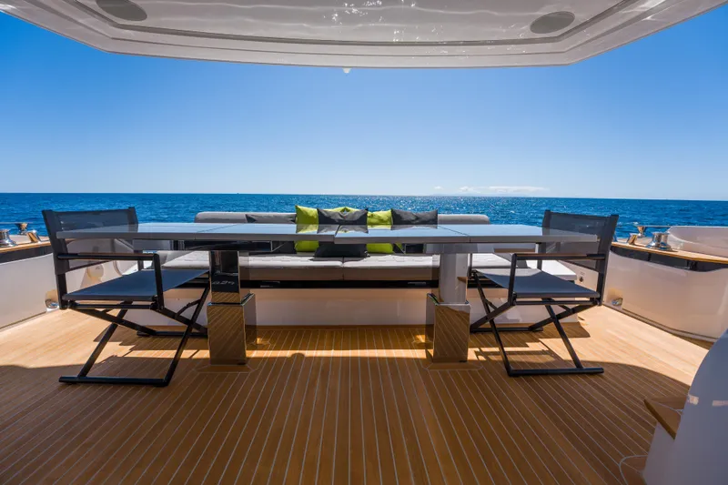 Slide: The Image of Luxury yacht Pearl 72 deck with ocean view, featuring modern seating, 2024 model. - 89