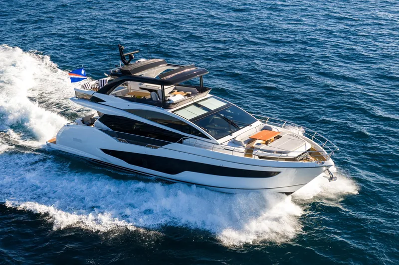 Slide: The Image of Luxurious 2024 Pearl 72 yacht cruising on open sea, showcasing sleek design and elegance. - 9
