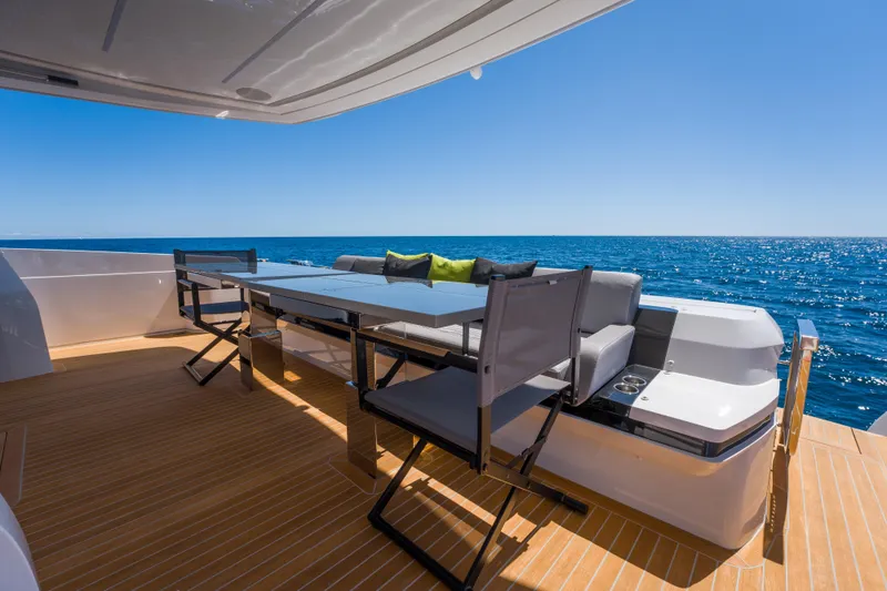 Slide: The Image of Luxurious Pearl 72 yacht deck with seating, ocean view, and modern design, 2024 model. - 90