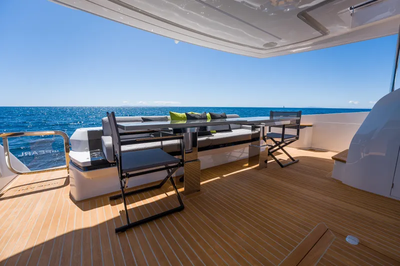 Slide: The Image of Luxurious deck of 2024 Pearl 72 yacht with ocean view and modern seating. - 92