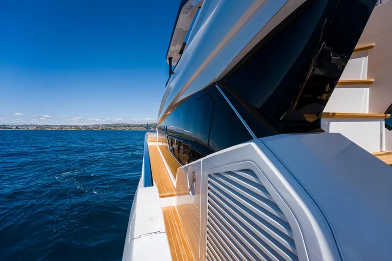 Slide: The Image of Luxurious 2024 Pearl 72 yacht cruising on open sea under clear blue sky. - 95