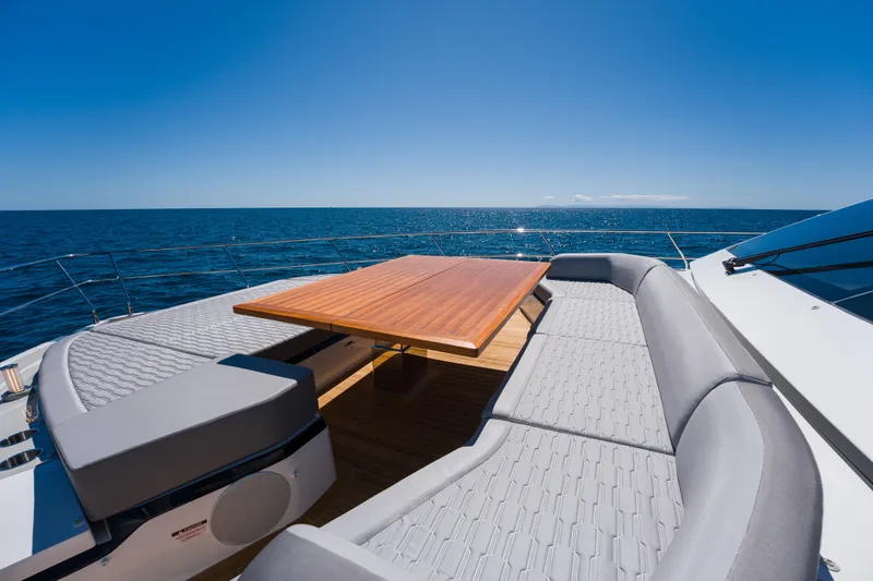 Slide: The Image of Luxurious Pearl 72 yacht deck with seating and table, 2024 model, ocean view. - 98