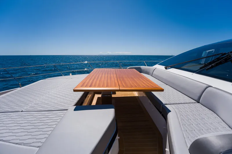 Slide: The Image of Luxurious Pearl 72 yacht deck with wooden table, ocean view, 2024 model. - 99
