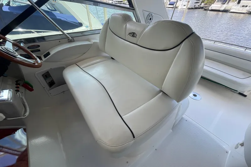 Slide: The Image of 1997 Bayliner 4085 Avanti boat interior with white leather seating and steering wheel. - 15