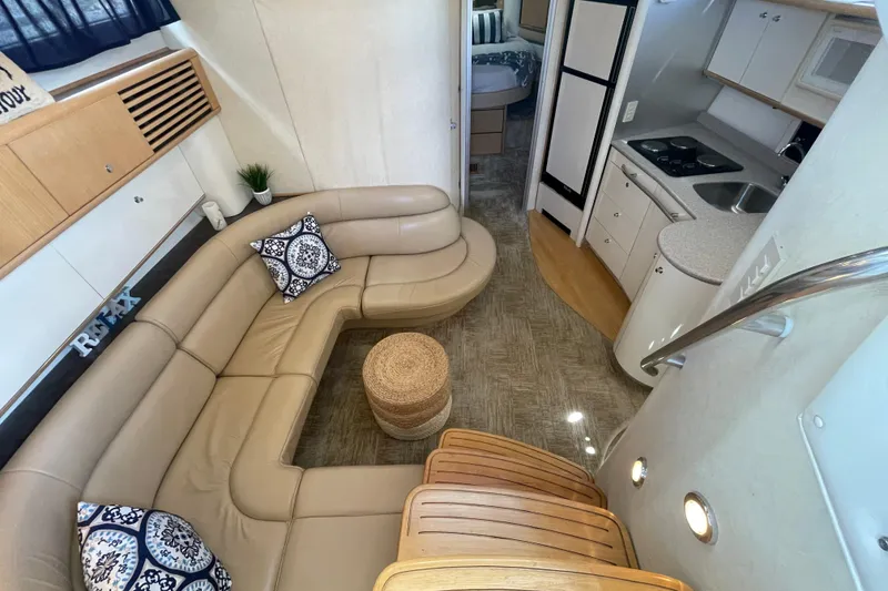 Slide: The Image of Luxurious interior of 1997 Bayliner 4085 Avanti yacht with leather seating and modern kitchen. - 21