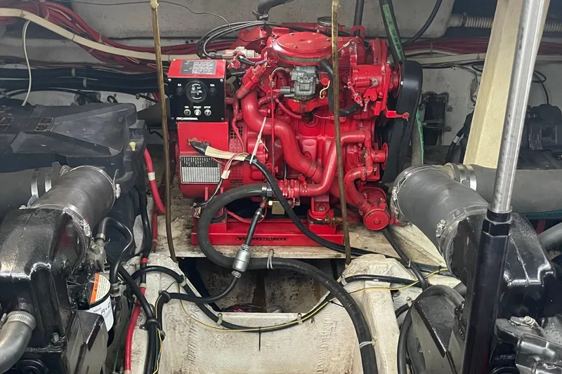 Slide: The Image of Engine room of a 1997 Bayliner 4085 Avanti with a red engine. - 32