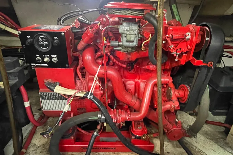 Slide: The Image of Red engine of a 1997 Bayliner 4085 Avanti boat, showcasing intricate mechanical components. - 33