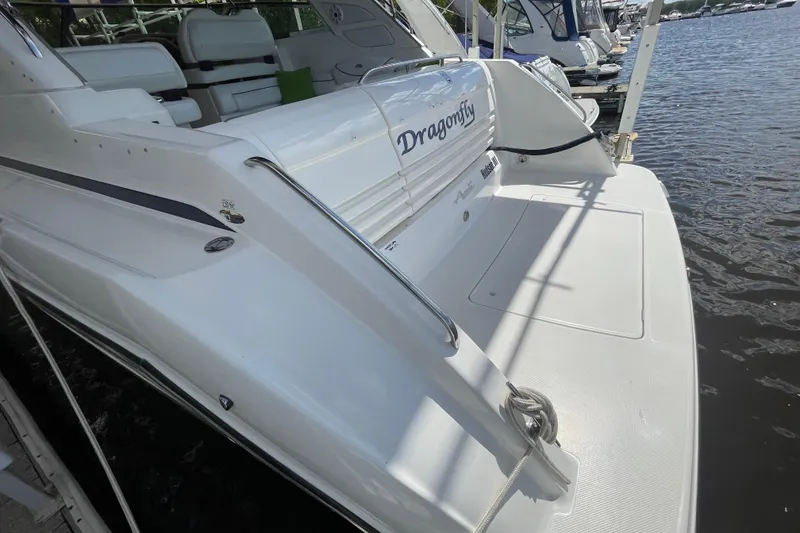 Slide: The Image of 1997 Bayliner 4085 Avanti boat docked, featuring spacious deck and seating area. - 6