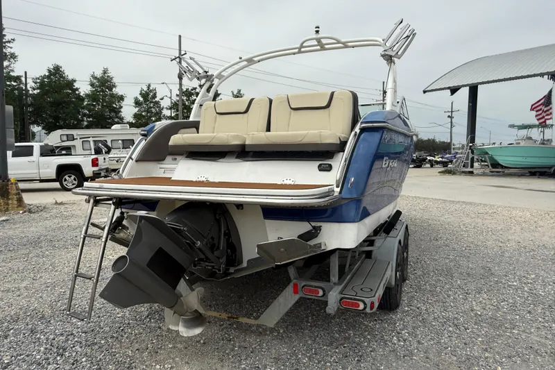 Slide: The Image of 2018 Bryant Calandra boat on trailer, rear view, parked outdoors. - 10