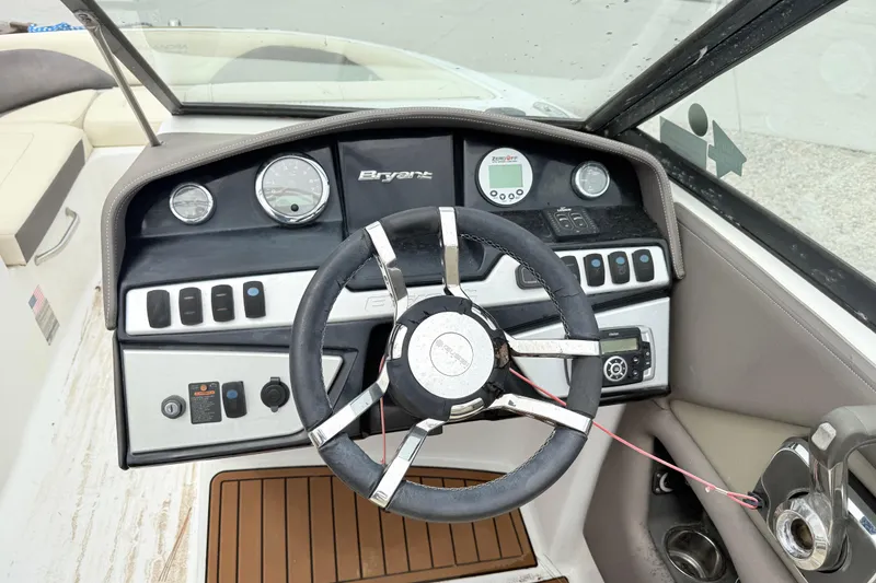 Slide: The Image of Steering console of a 2018 Bryant Calandra boat with gauges and controls. - 14