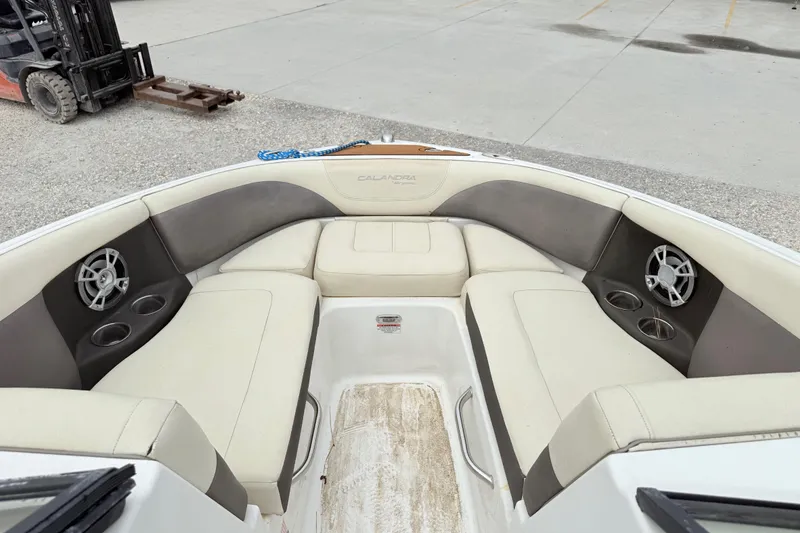 Slide: The Image of Luxurious 2018 Bryant Calandra boat interior with plush seating and built-in speakers. - 16