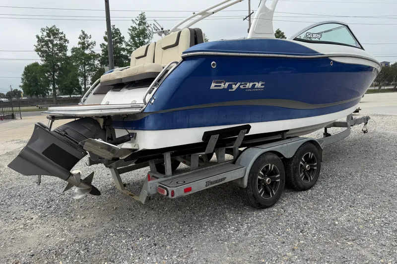 Slide: The Image of Blue 2018 Bryant Calandra boat on trailer, parked on gravel lot. - 3