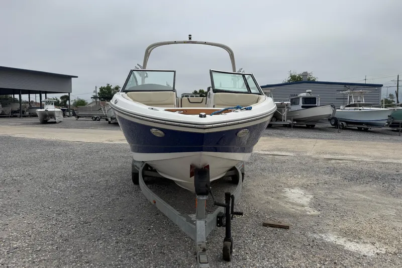 Slide: The Image of 2018 Bryant Calandra boat on trailer in outdoor storage area. - 5