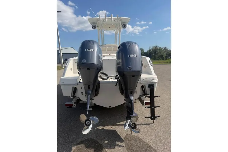 Slide: The Image of 2018 Robalo R242 Center Console boat with dual Yamaha 150 outboard engines. - 12
