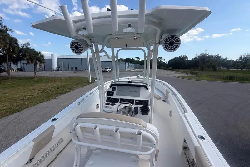 Slide: The Image of 2018 Robalo R242 Center Console boat with advanced navigation system and spacious deck. - 13