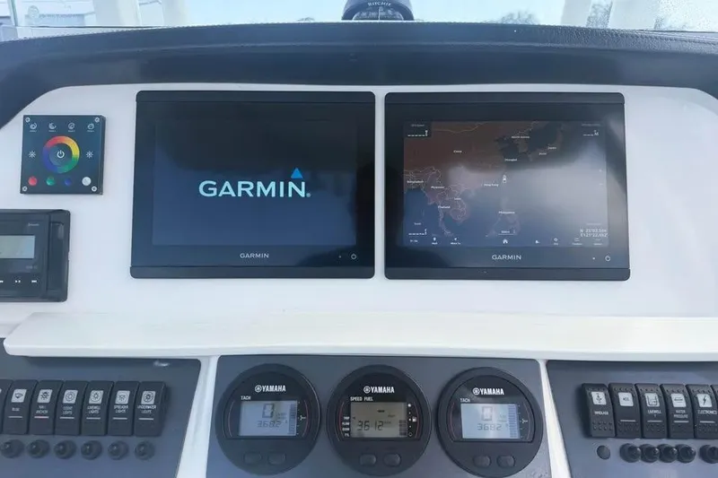 Slide: The Image of 2018 Robalo R242 Center Console dashboard with Garmin navigation displays and Yamaha controls. - 16
