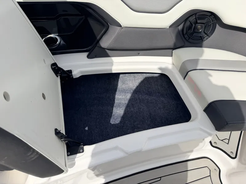 Slide: The Image of 2020 Yamaha 212S Jet Boat seating area with storage and speaker. - 16