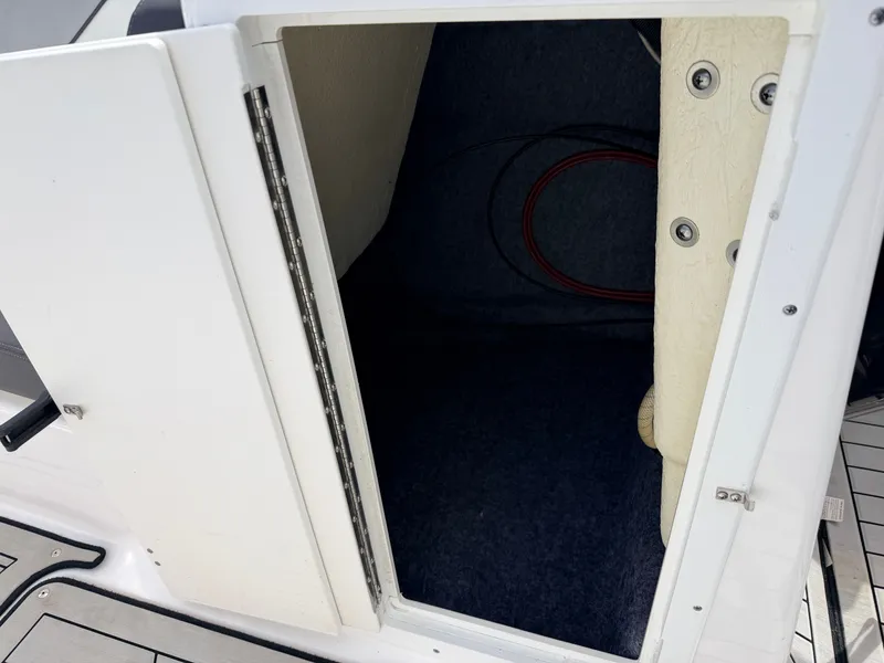Slide: The Image of Yamaha 212S Jet Boat 2020 storage compartment with open door. - 23