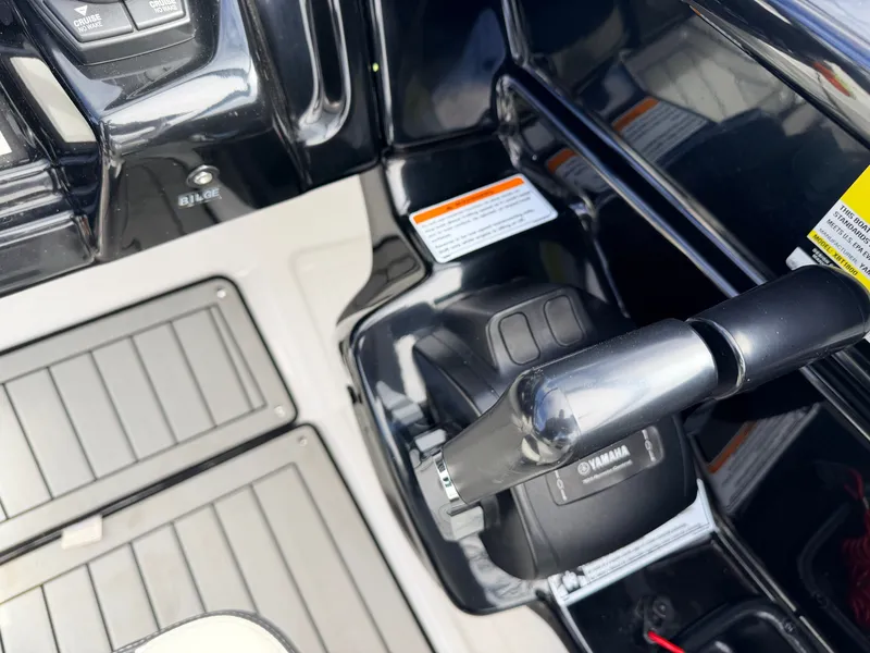 Slide: The Image of Interior view of Yamaha 212S Jet Boat, throttle lever and controls. - 30