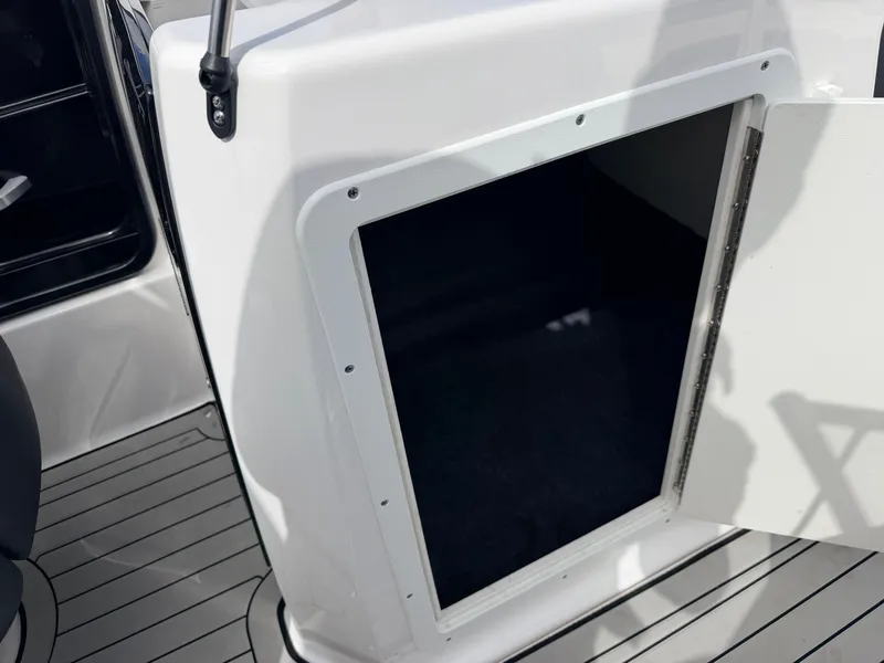 Slide: The Image of Yamaha 212S Jet Boat 2020, open storage hatch, gray flooring. - 35