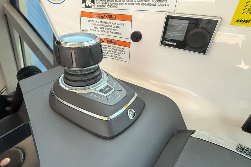 Slide: The Image of Joystick control panel on 2022 Axopar 37 XC Cross Cabin boat dashboard. - 16