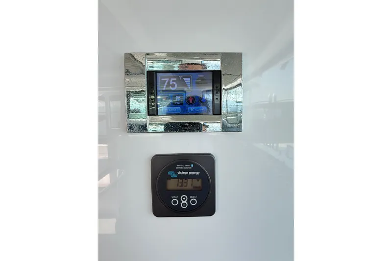 Slide: The Image of Digital control panels on 2022 Axopar 37 XC Cross Cabin boat interior. - 19