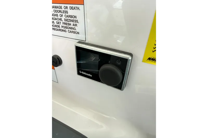 Slide: The Image of Control panel on 2022 Axopar 37 XC Cross Cabin boat with safety warnings. - 20