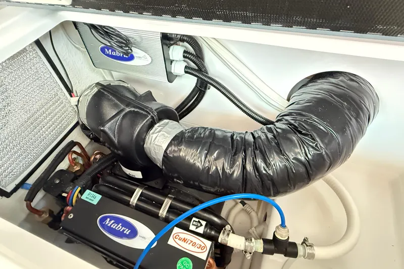 Slide: The Image of Engine compartment of 2022 Axopar 37 XC Cross Cabin with Mabru components. - 25