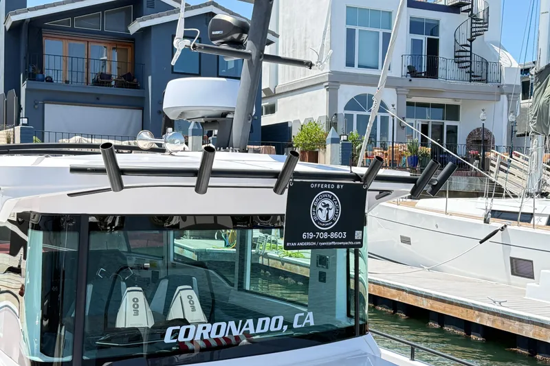 Slide: The Image of 2022 Axopar 37 XC Cross Cabin boat docked in Coronado, CA marina. - 5