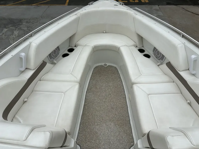 Slide: The Image of Interior of a 2004 Formula 280 Bow Rider boat with white seating. - 10