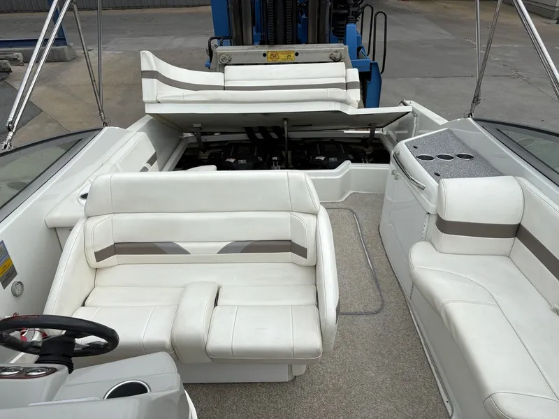 Slide: The Image of Interior of a 2004 Formula 280 Bow Rider boat with white seating. - 21