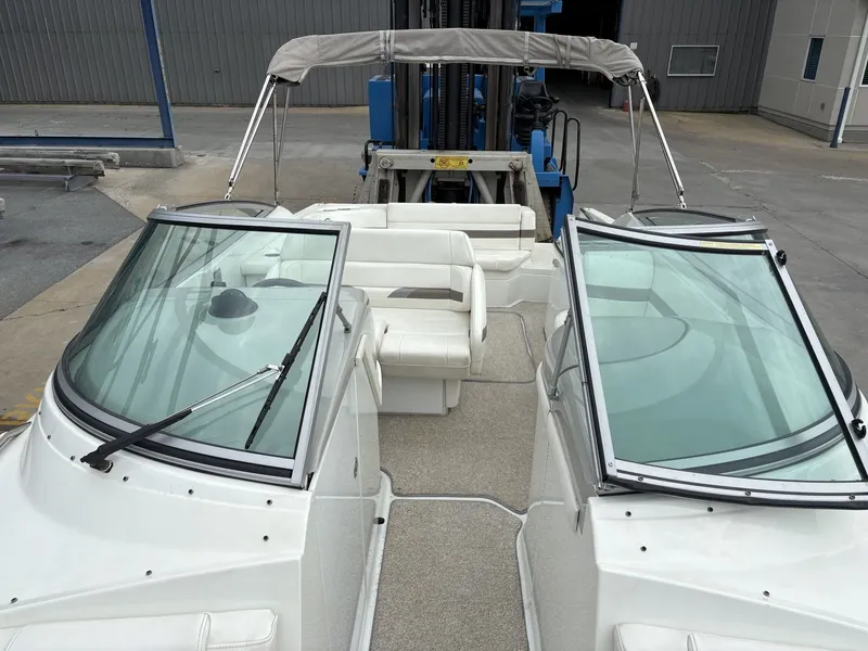 Slide: The Image of 2004 Formula 280 Bow Rider boat with white interior and windshield. - 24