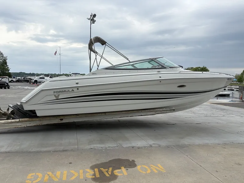 Slide: The Image of 2004 Formula 280 Bow Rider boat on trailer at harbor. - 26