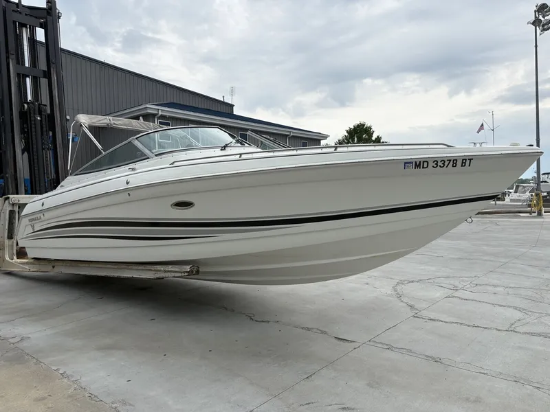 Slide: The Image of 2004 Formula 280 Bow Rider boat on a dry dock. - 28