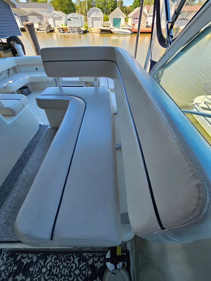 Slide: The Image of Interior of a 1997 Tiara Yachts 2900 Coronet with white seating area. - 10
