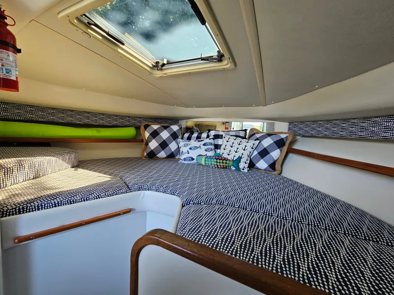 Slide: The Image of Interior of a 1997 Tiara Yachts 2900 Coronet with cozy cushions. - 12