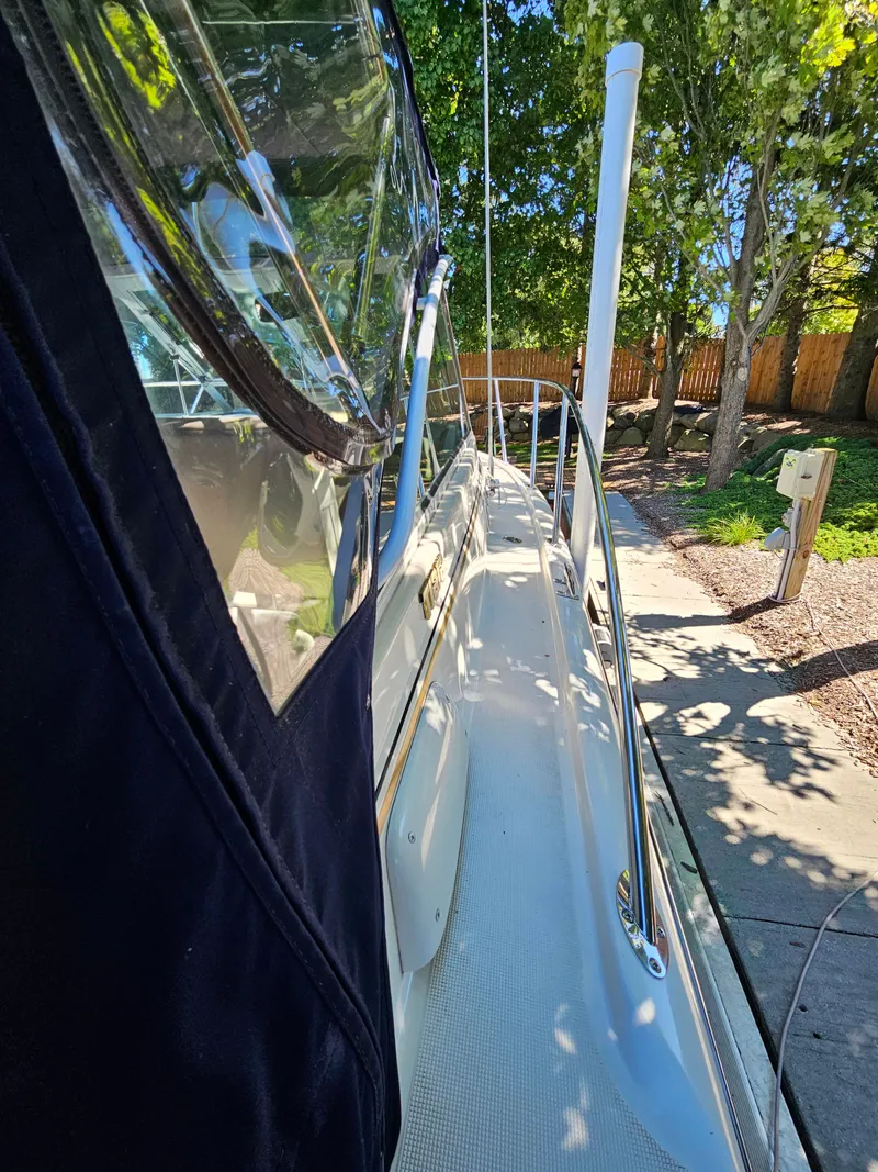 Slide: The Image of 1997 Tiara Yachts 2900 Coronet at dock, side view. - 8