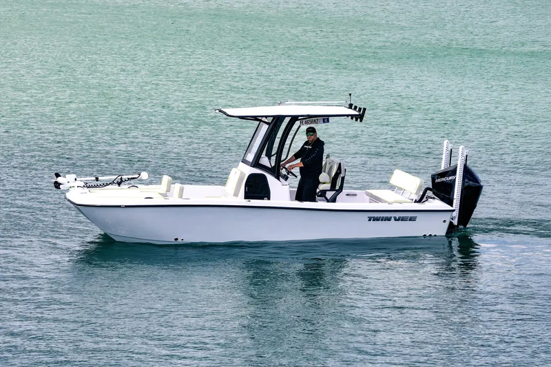 The Image of 2026 Twin Vee 22 BayCat boat cruising on calm turquoise waters. - 1