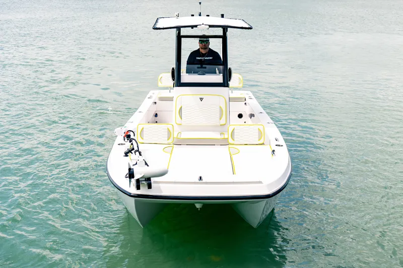 Slide: The Image of 2026 Twin Vee 22 BayCat boat on calm water, front view. - 5