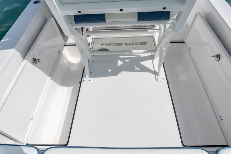 Slide: The Image of 2026 Twin Vee 22 BayCat boat interior with spacious deck and storage compartments. - 6